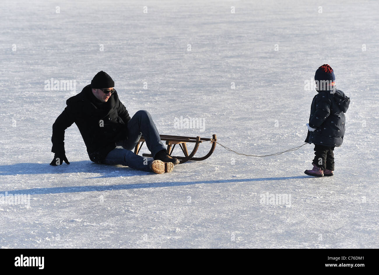 father and child with sleigh, Berlin, Germany Stock Photo