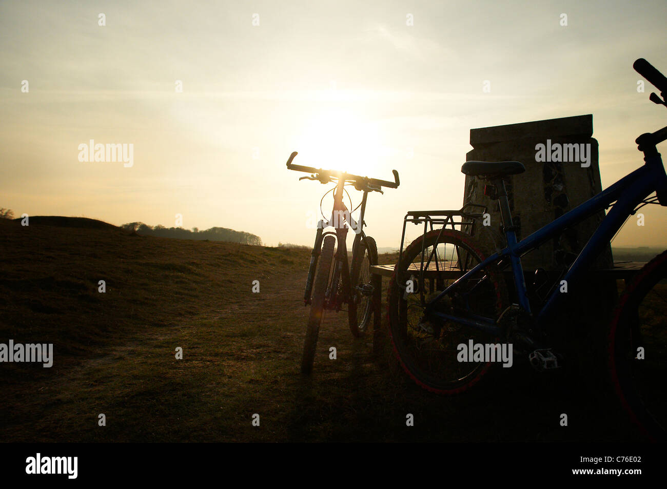 Mountain bikes in sunset in the hills Stock Photo