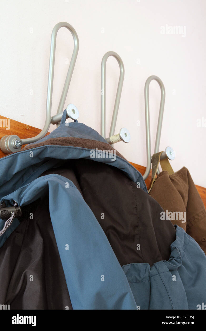 A Row of Coat Pegs with Coat Stock Photo Alamy