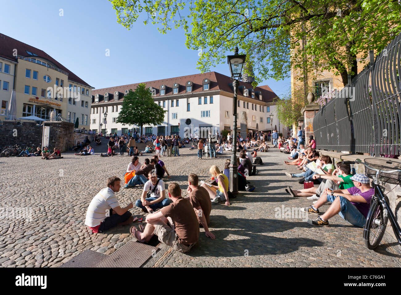 PEOPLE AT AUGUSTINERPLACE SQUARE, FREIBURG IM BREISGAU, BLACK FOREST, BADENWURTTEMBERG, GERMANY