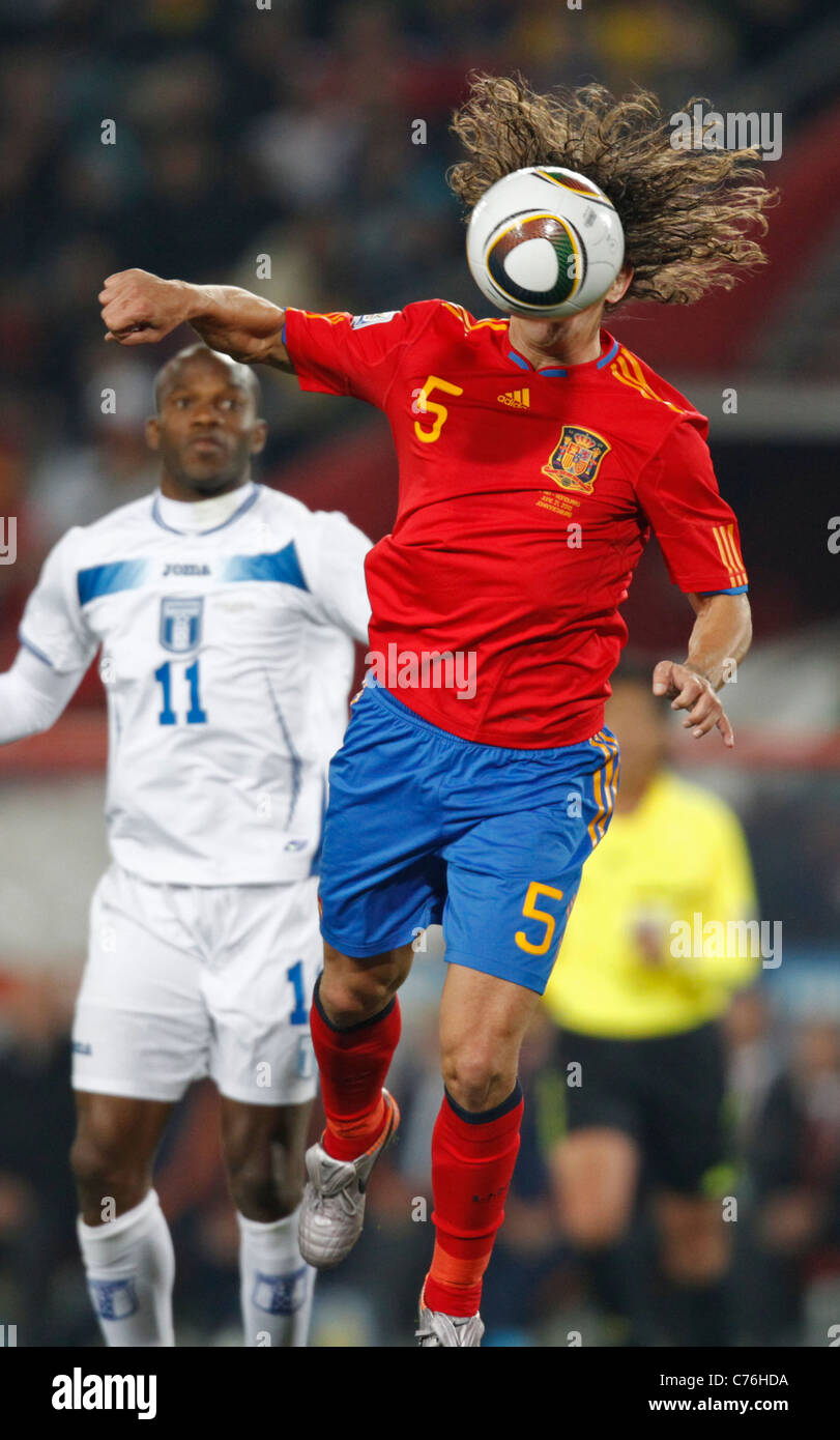 Carles Puyol of Spain (5) heads the ball during a FIFA World Cup match against Honduras June 21, 2010 at Ellis Park Stadium. Stock Photo