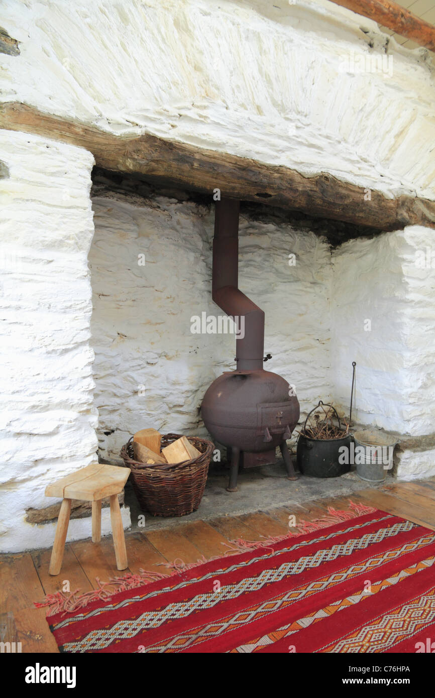 A pot bellied stove in a traditional Irish fireplace, County Kerry, Rep. of Ireland Stock Photo