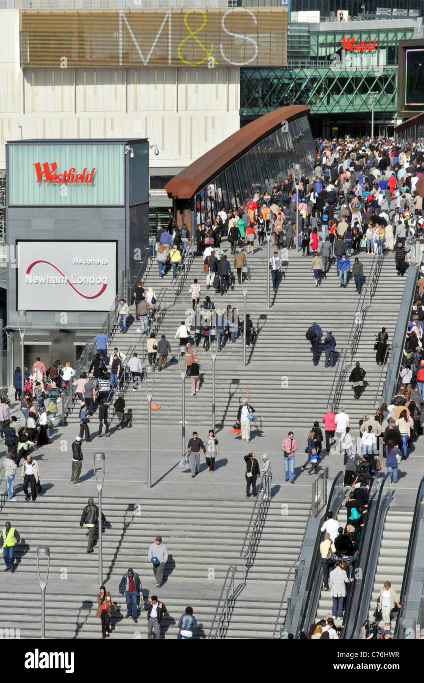 Aerial view crowds of people queue at Westfield Shopping Centre entrance steps & escalators below M&S sign lifestyle shoppers Stratford East London UK Stock Photo