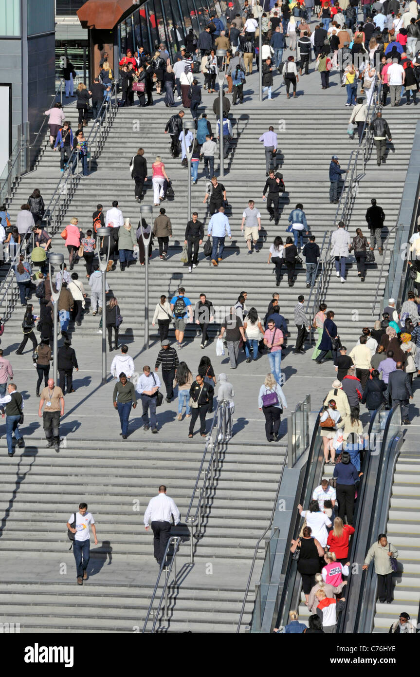 Aerial birds eye view crowds of people entrance steps & escalator approaches Westfield Shopping Centre at Stratford City Newham East London England UK Stock Photo