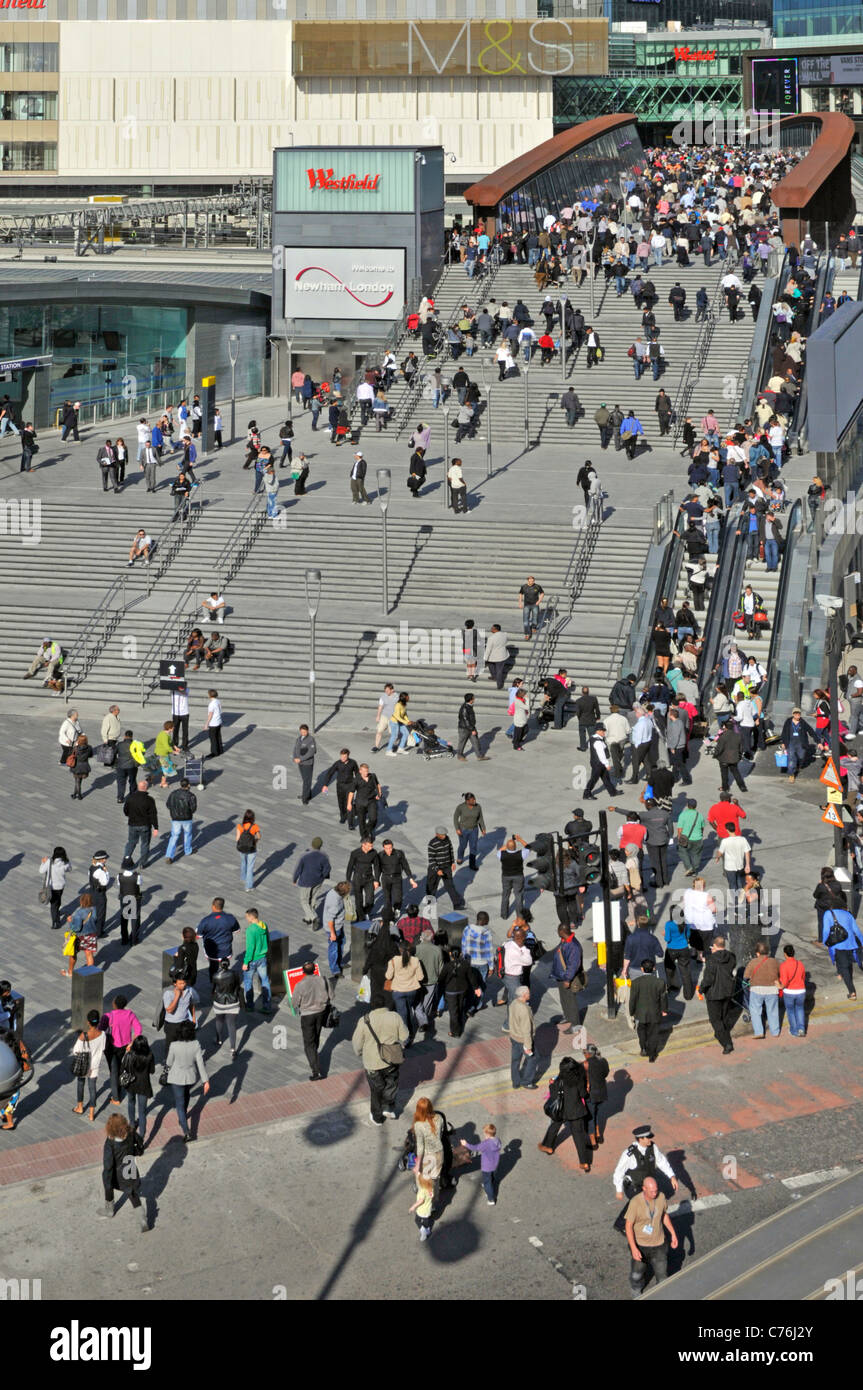 Aerial view crowds of people Westfield Shopping Centre high level  bridge entrance steps & escalators shoppers lifestyle Stratford East London UK Stock Photo
