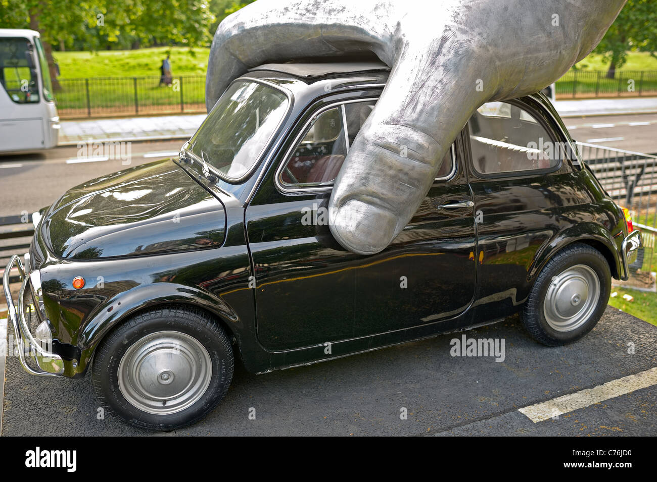 Hand pushing car sculpture -- Vroom Vroom -- by Lorenzo Quinn, Park Lane, London, England, UK, Europe Stock Photo