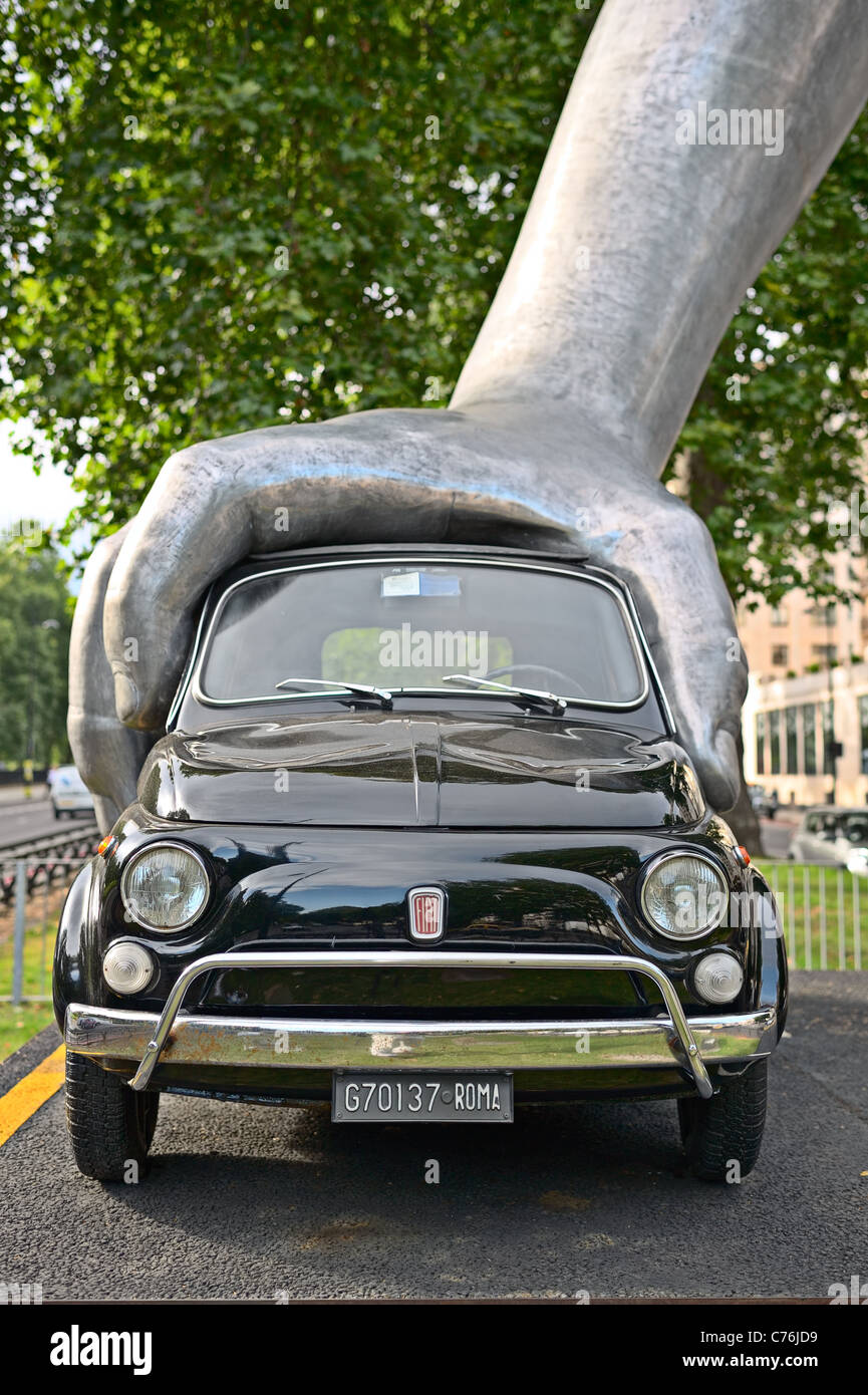Hand pushing car sculpture -- Vroom Vroom -- by Lorenzo Quinn, Park Lane, London, England, UK, Europe Stock Photo