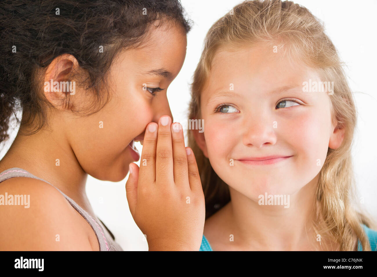 Girls children whispering secret hi res stock photography and images