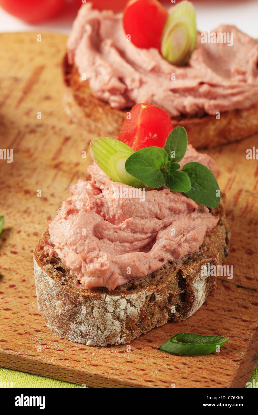 Slices of bread with delicious liver pate Stock Photo