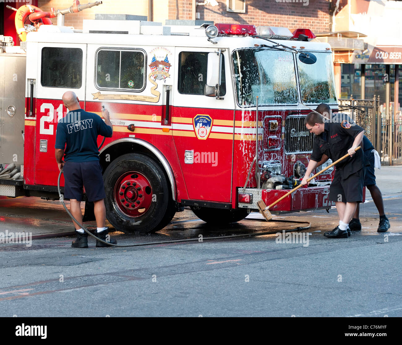 NYC firefights washing a truck Stock Photo