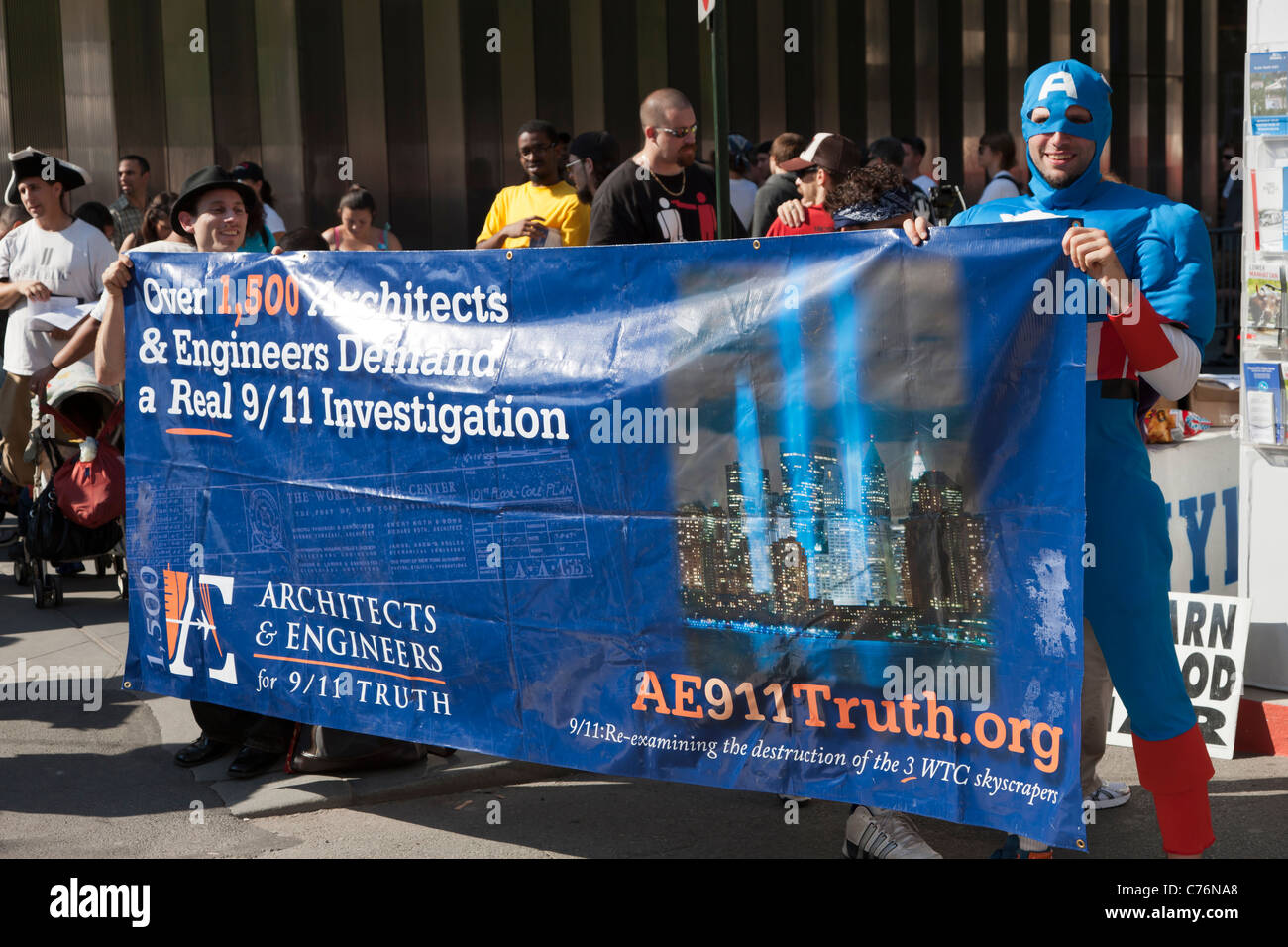 Supporters of Architects & Engineers for 9/11 Truth (AE911Truth) hold up a banner at the WTC PATH station. Stock Photo