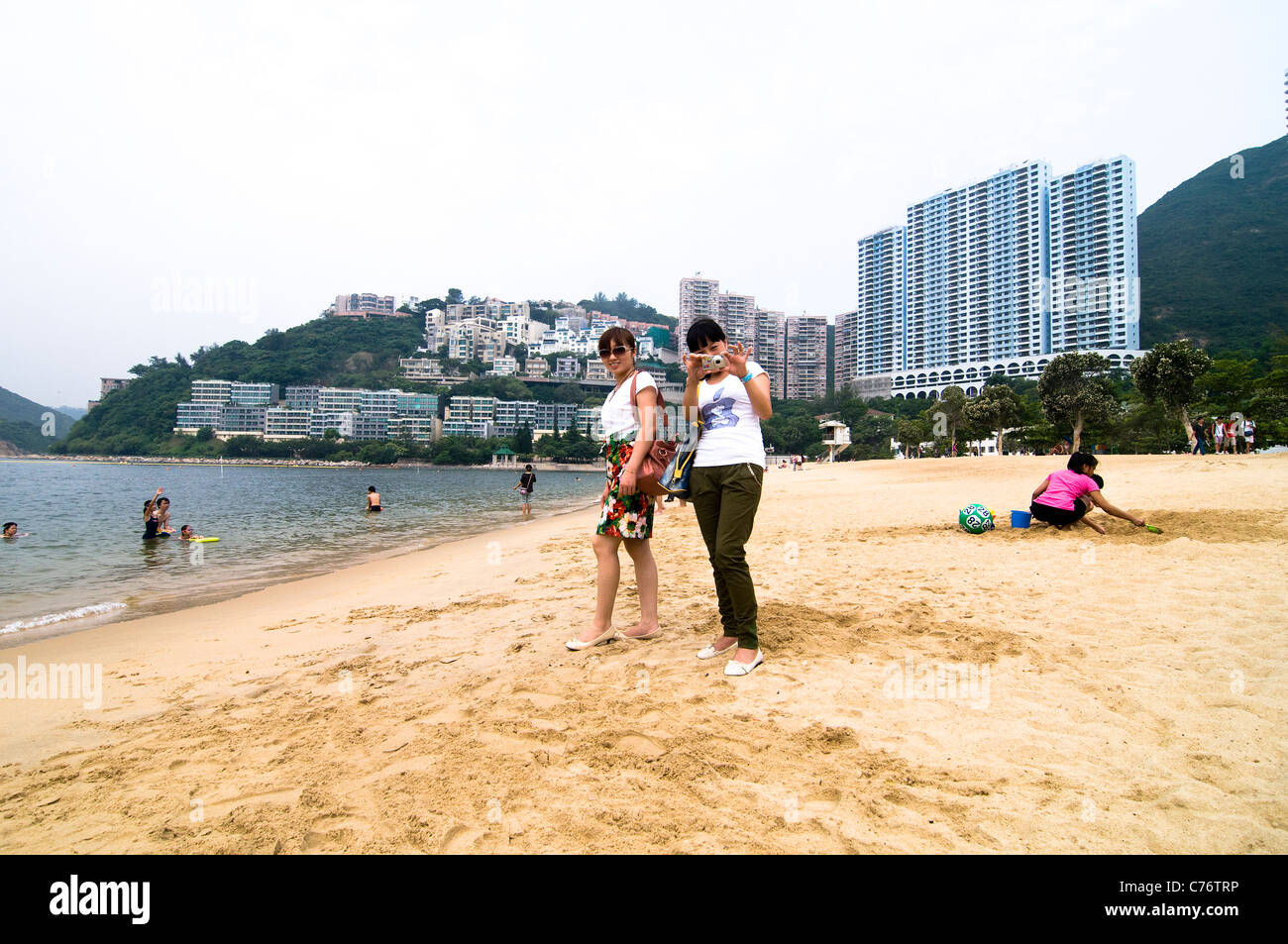 Mainland Chinese tourist having fun on the beach in Repulse bay, Hong Kong. Stock Photo