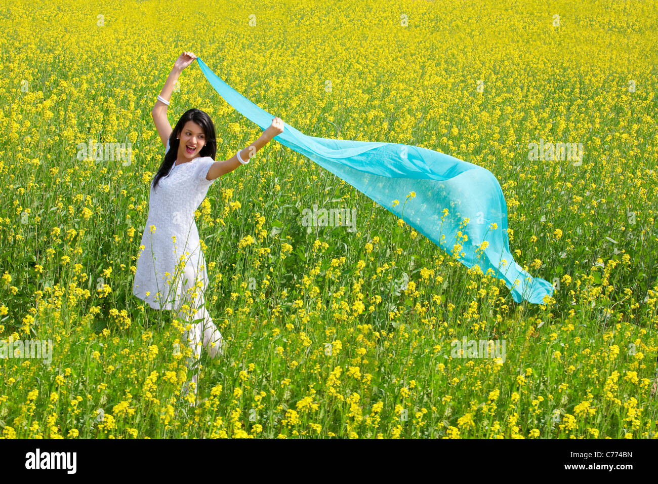 Woman enjoying herself in a field Stock Photo