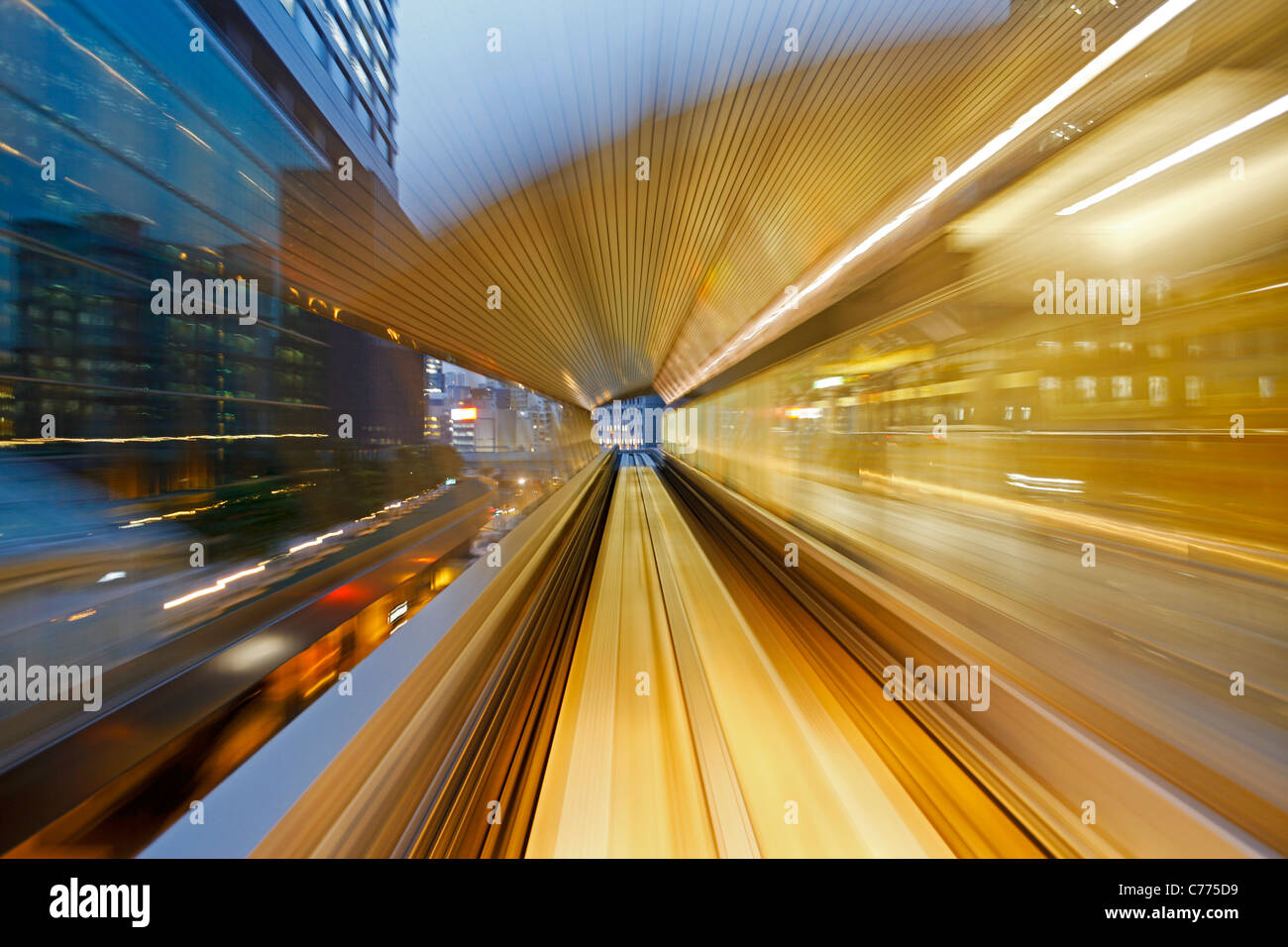 Asia, Japan, Honshu, Tokyo, POV blurred motion of Tokyo buildings from a moving train Stock Photo