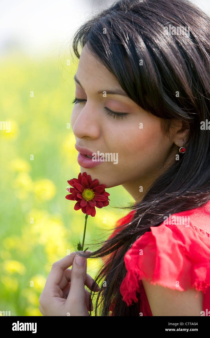 Young woman with a flower Stock Photo