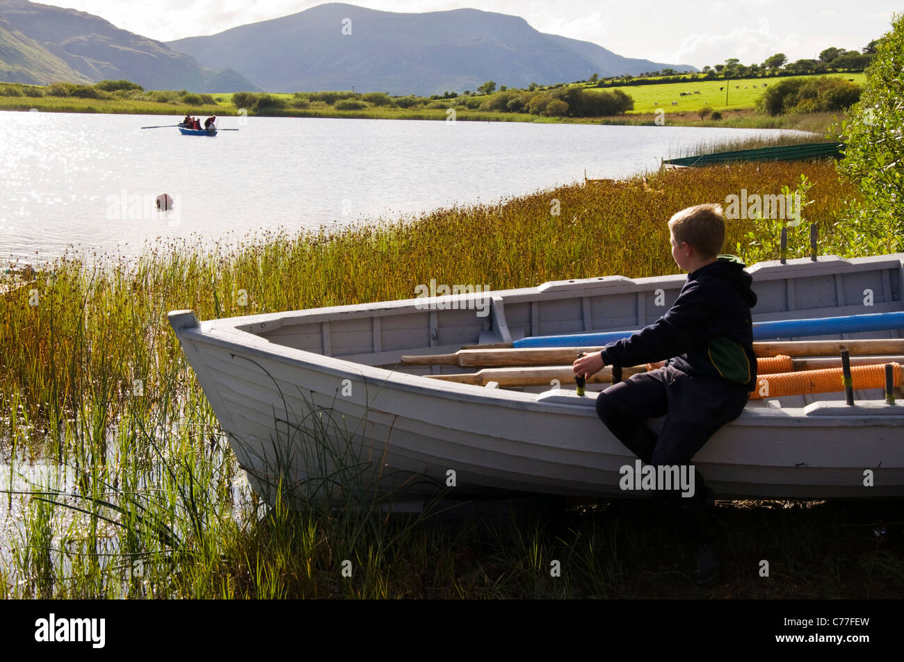 Children Fishing From Boat Stock Photos &amp; Children Fishing ...