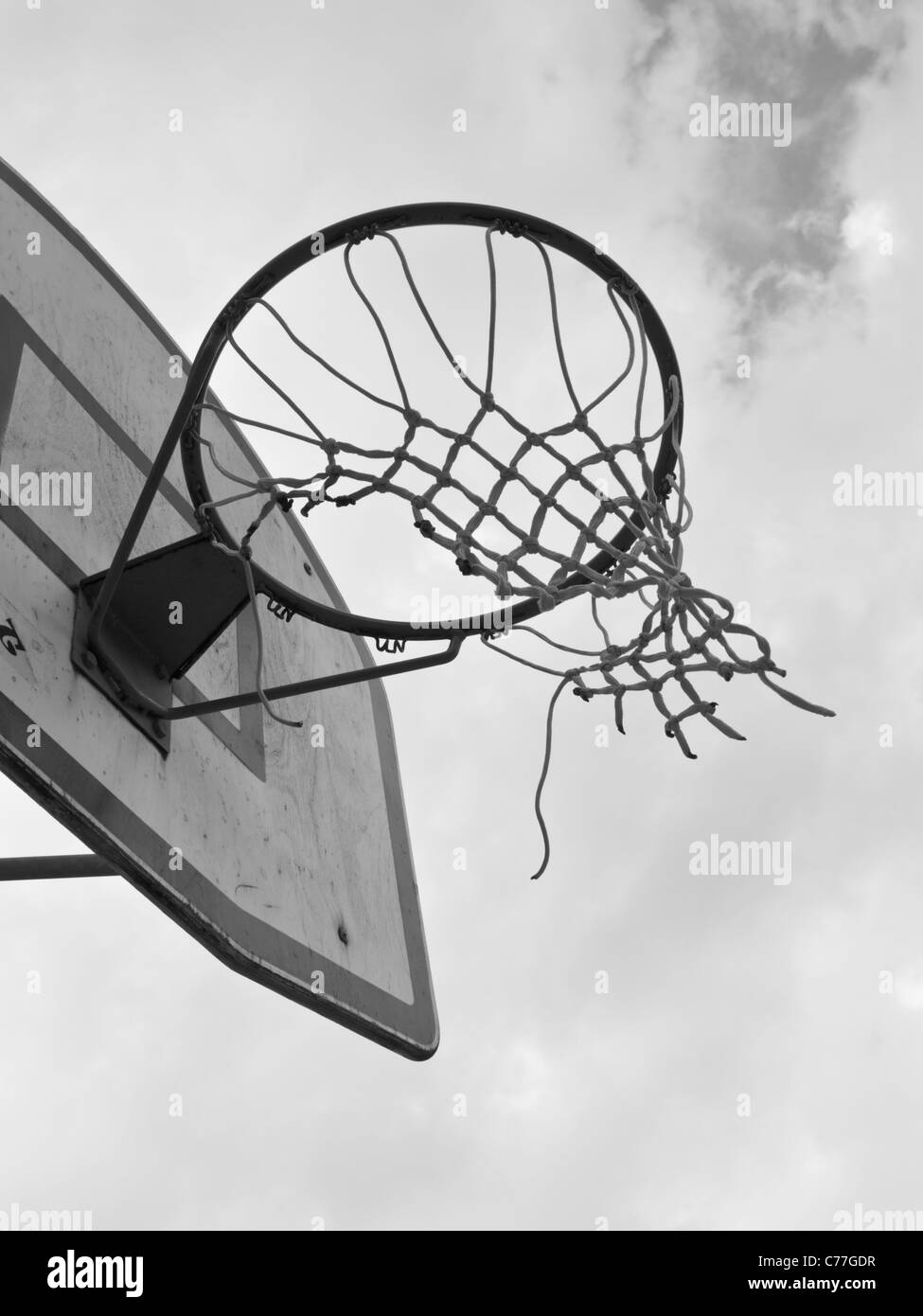 Basketball basket with broken net Stock Photo - Alamy