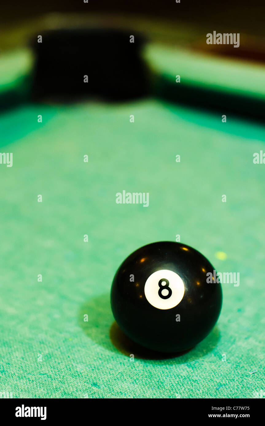 a close up of billiard ball number 8, solid black, for conceptual usage. Stock Photo