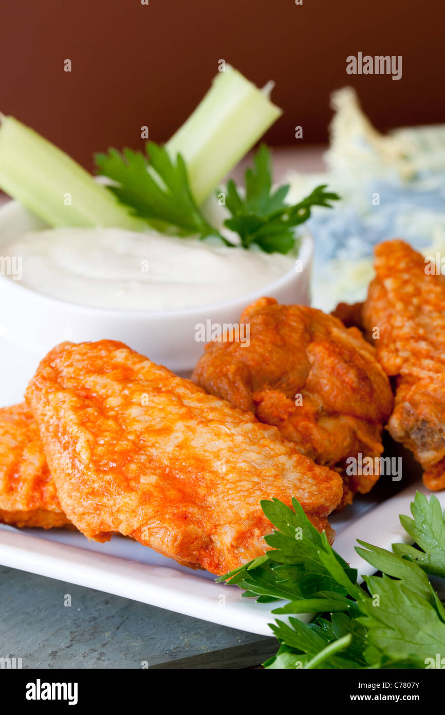 Hot and Spicy Buffalo Wings with Blue Cheese Dipping Sauce Stock Photo
