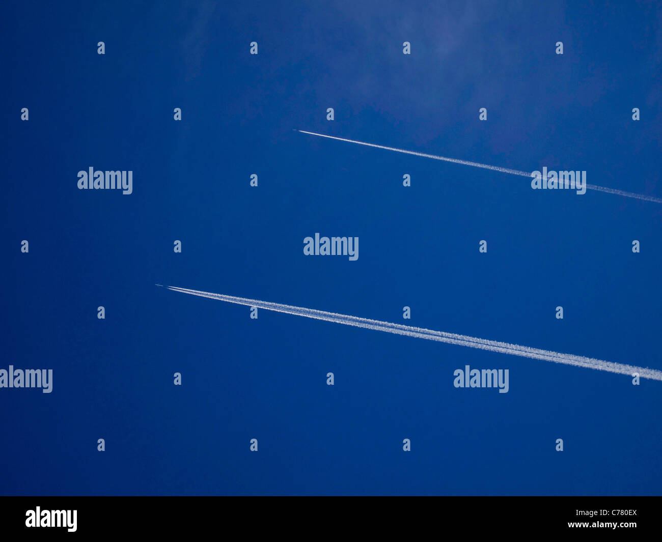 Airplane in a blue sky Stock Photo - Alamy