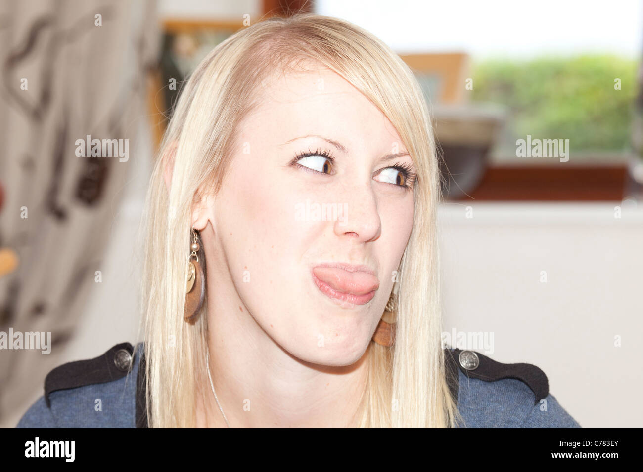 teenage girl making funny faces Stock Photo