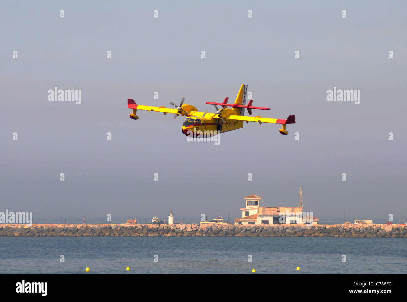 Bombardier/Canadair CL415 fire bomber collecting seawater, Calahonda, Costa del Sol, Malaga Province, Andalucia, Spain, Europe. Stock Photo