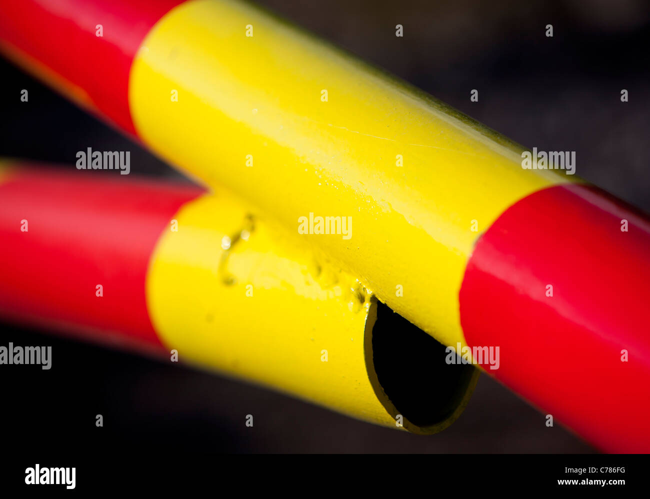 Closeup of red and yellow striped metal boom Stock Photo