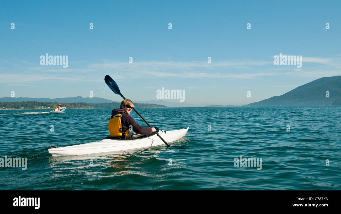 Lummi Island, San Juan Islands, Washington. Woman sea kayaking Stock Photo Alamy
