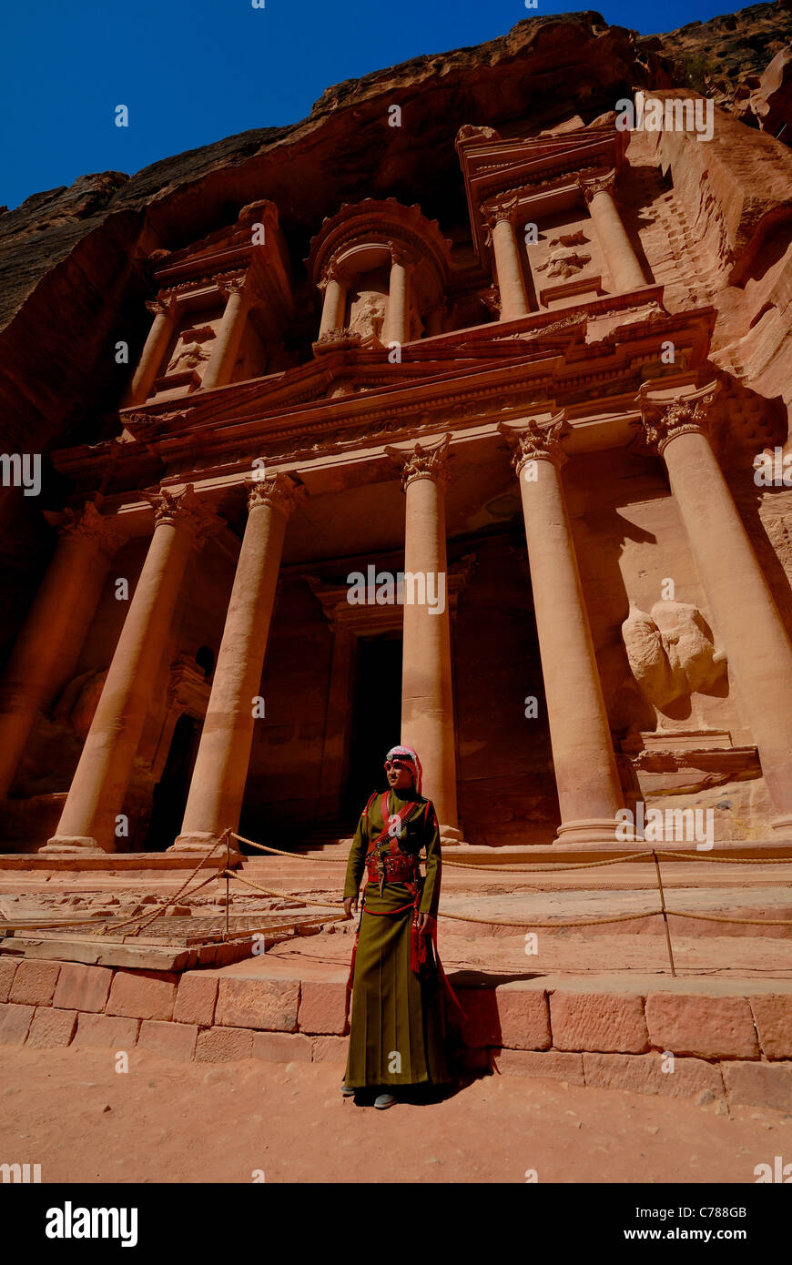 Jordanian soldier standing guard in frond of The treasury in Petra, Jordan. Stock Photo
