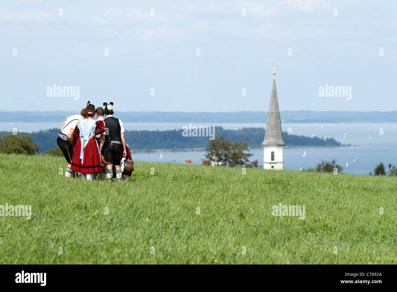 Young Bavarian people gathered in traditional Bavarian costumes ...