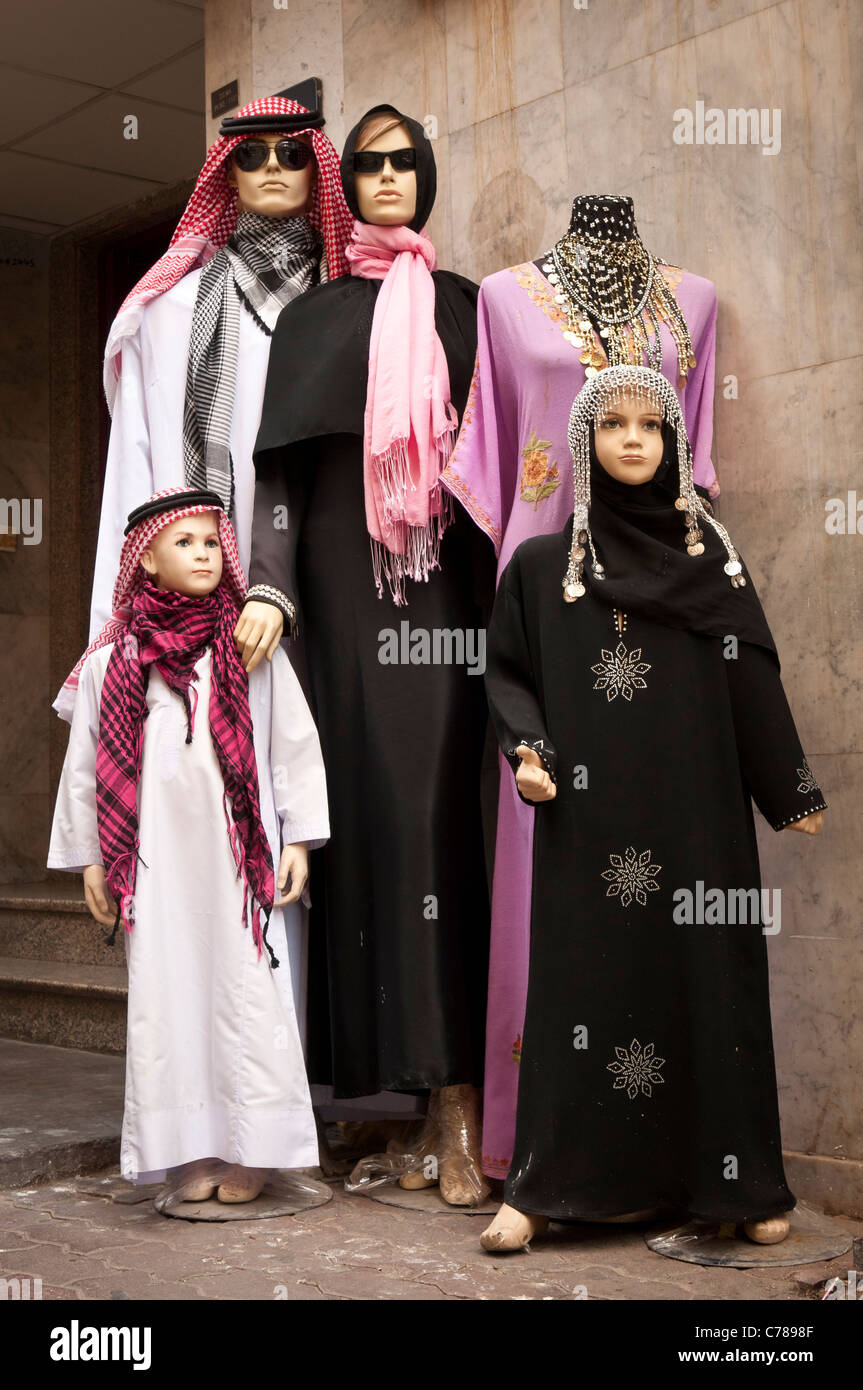 Mannequins dressed in upscale fashion Arab clothing at a store in the Gold Souk district, Dubai, United Arab Emirates. Stock Photo