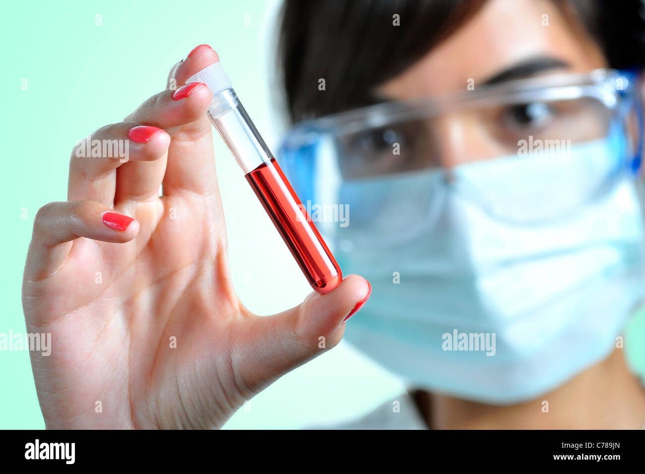 Women looking at a blood sample Stock Photo