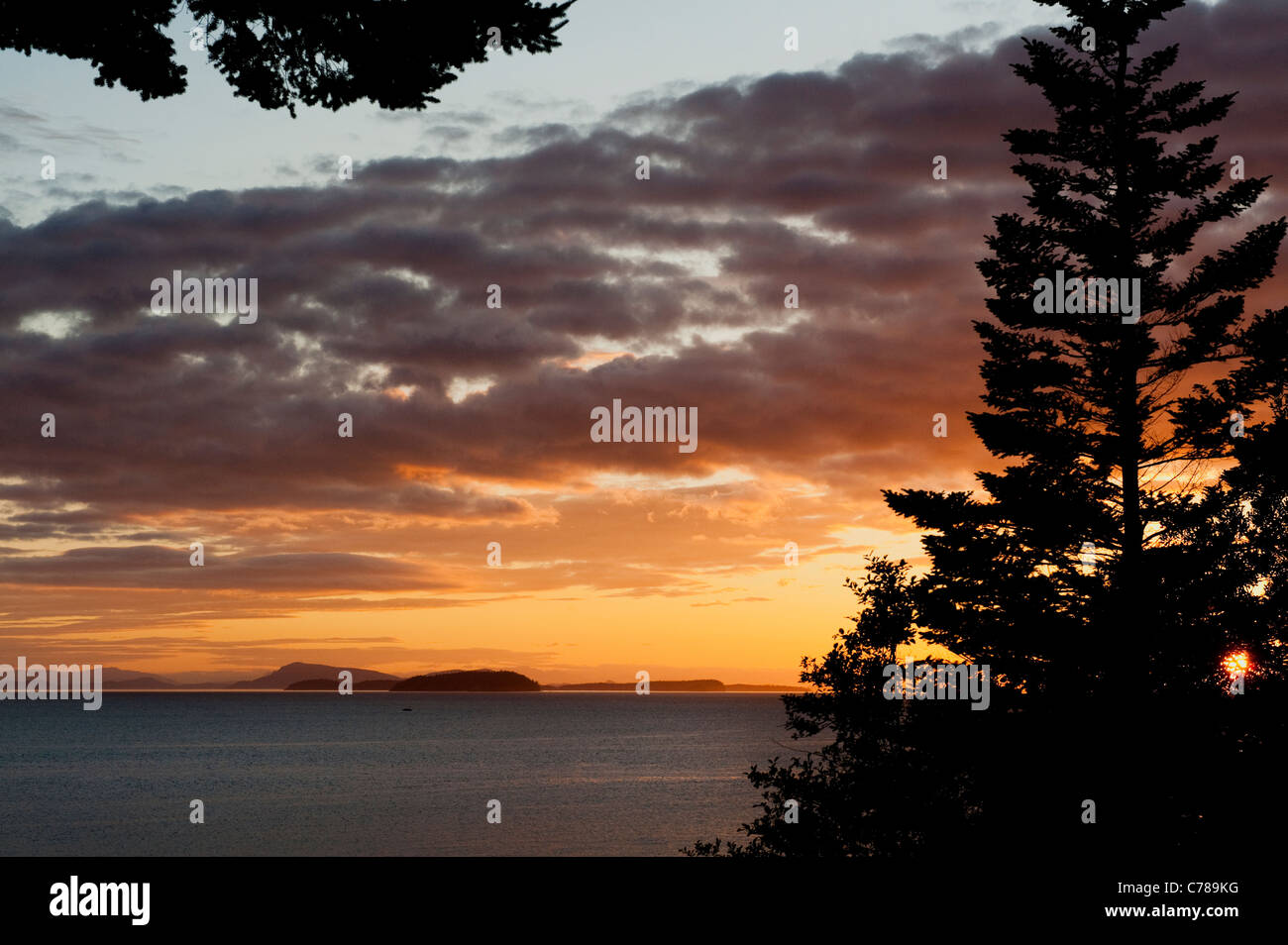 A beautiful sunset view of the San Juan Islands in the Puget Sound area ...
