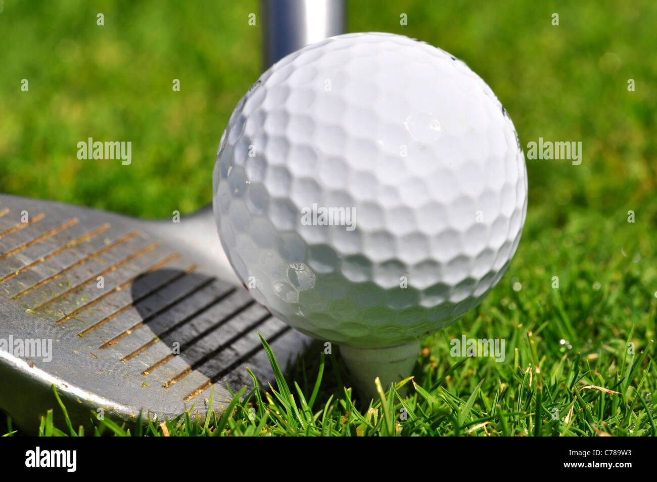 Golf ball and driver, ready to strike Stock Photo