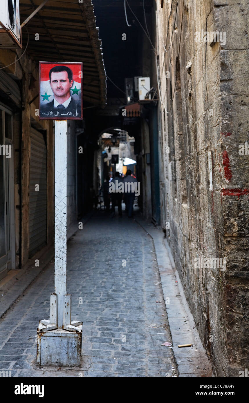 Alley with a picture of the Syrian president, Aleppo, Syria Stock Photo