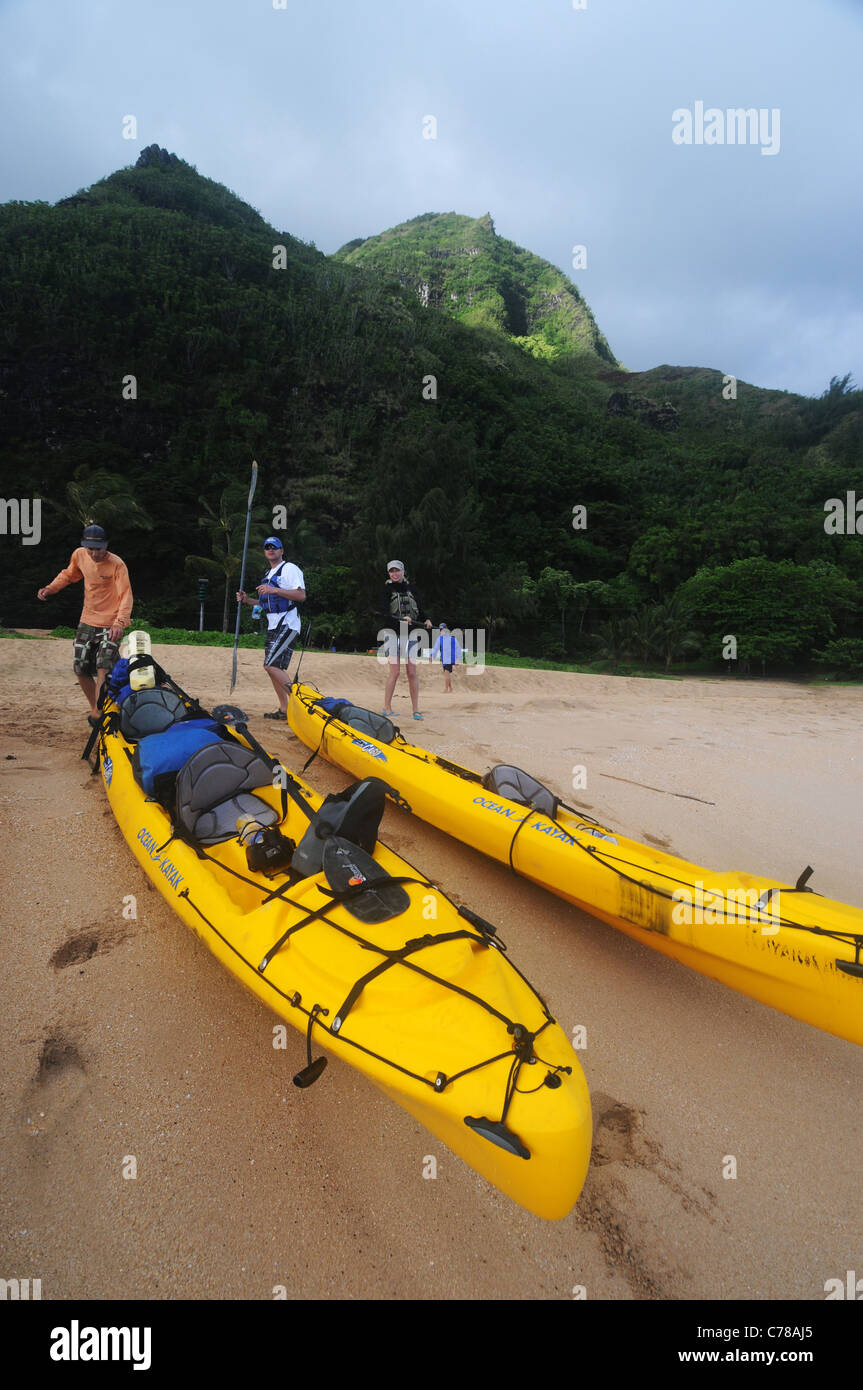 Sea kayakers about to set off from beach on Kauai, Hawaii, USA. No MR or PR Stock Photo