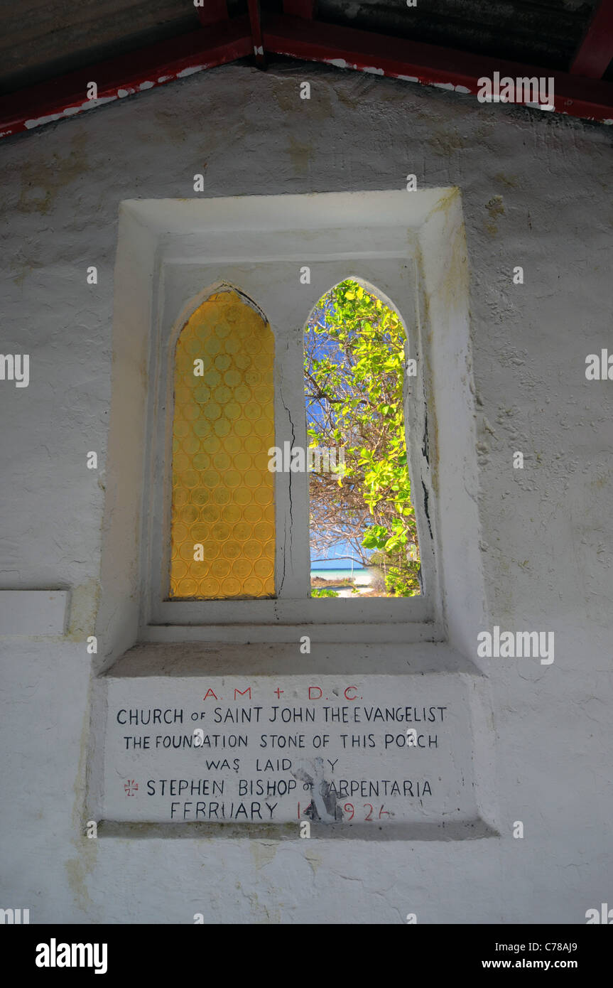 Porch window and foundation stone of the Church of St John the Evangelist,on Masig Island (aka Yorke Island), Torres Strait Stock Photo