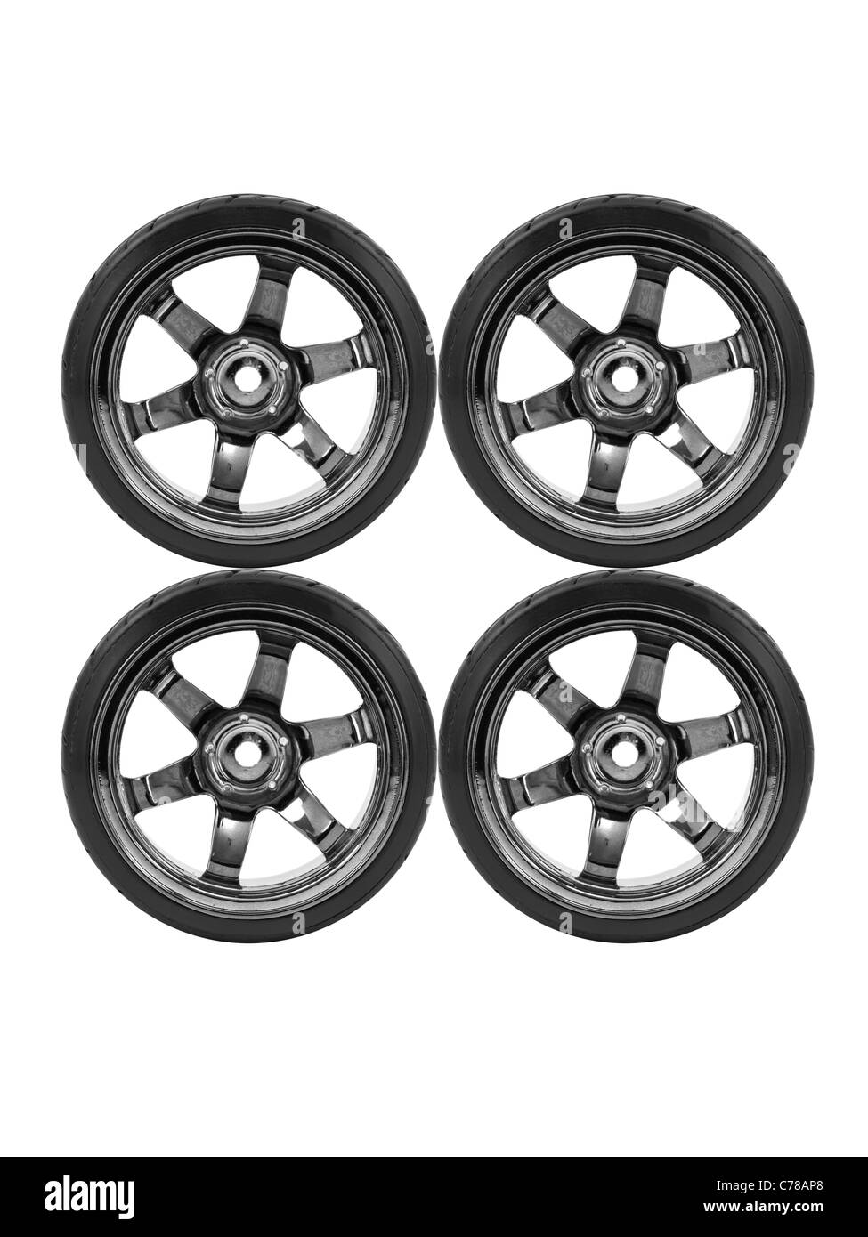 Rubber tyres with sports rims on a white background Stock Photo - Alamy