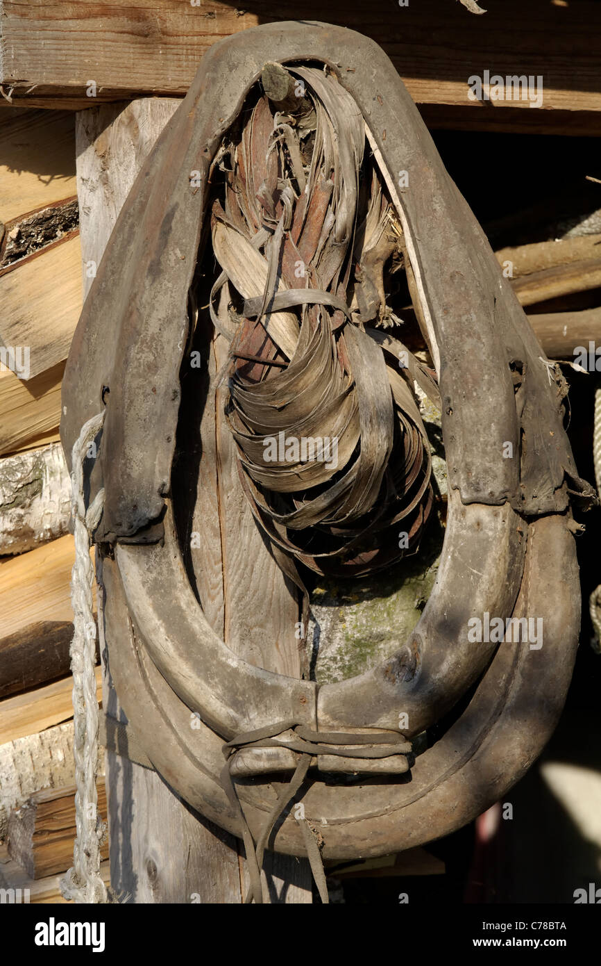 Old horse collar hanging over the entry into a barn Stock Photo Alamy
