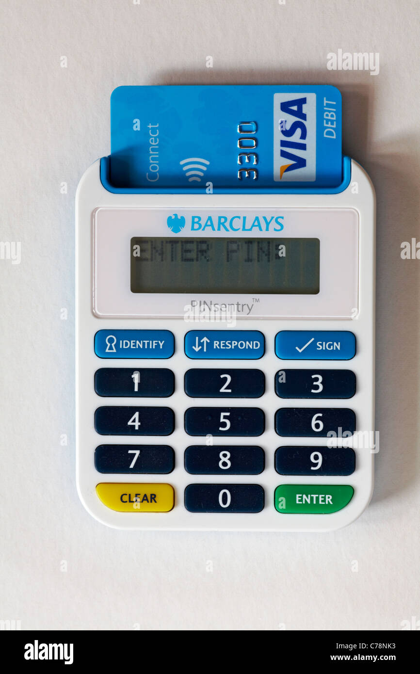 Visa connect card inserted into Barclays Pinsentry machine ready to input pin number isolated on white background Stock Photo
