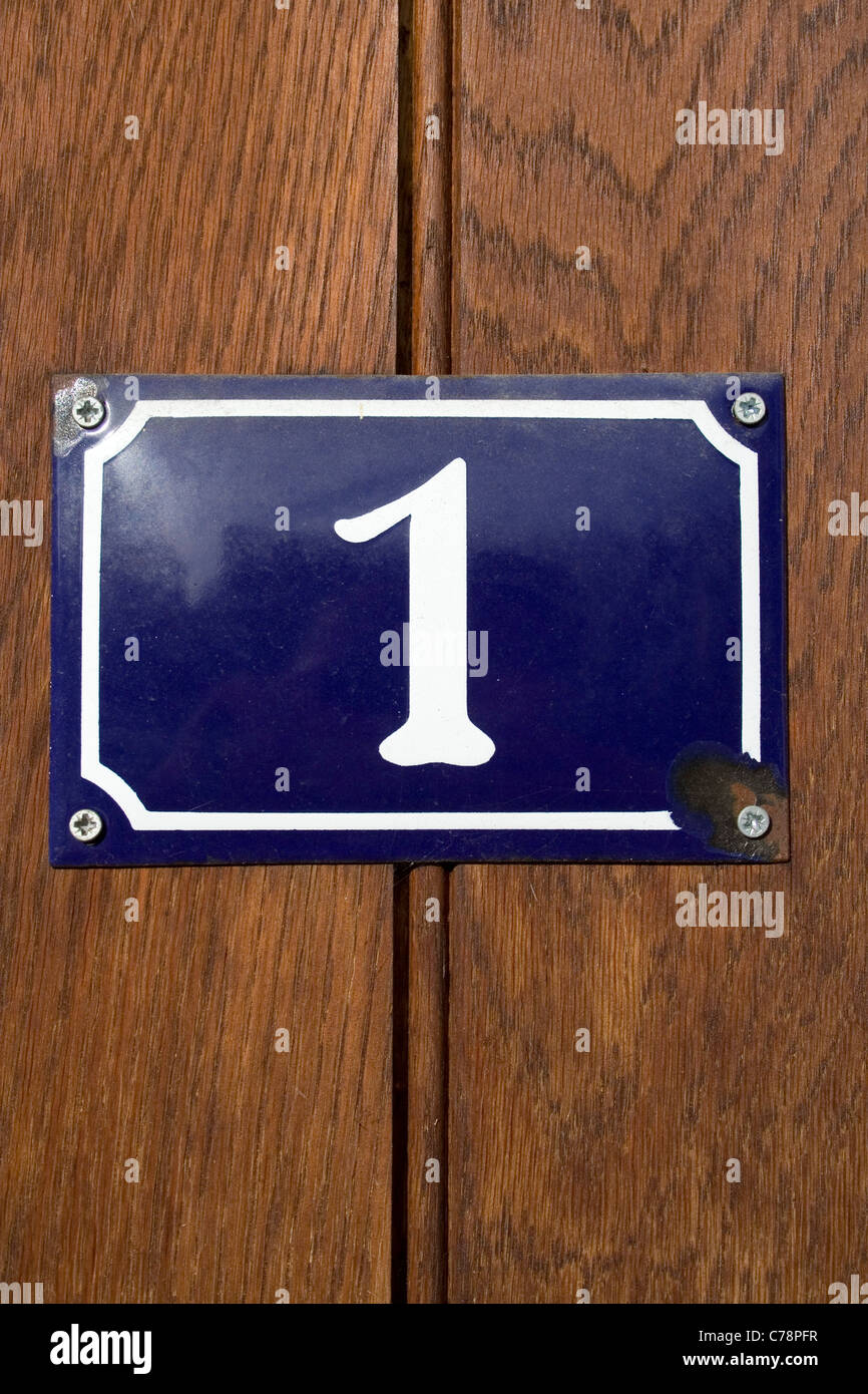 A Blue Enamel Door Number Bearing The Numeral One Stock Photo