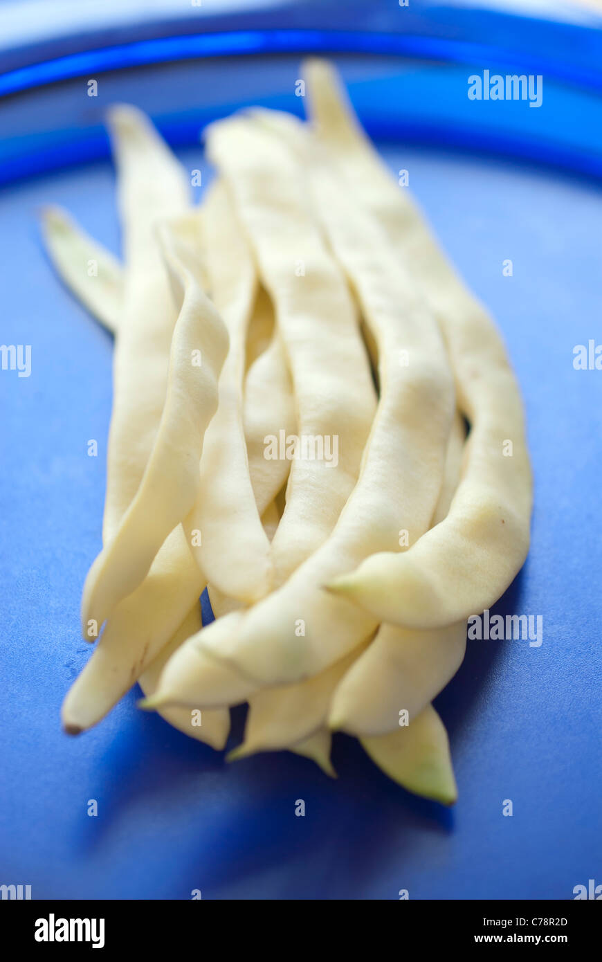 string beans on a blue plate Stock Photo Alamy
