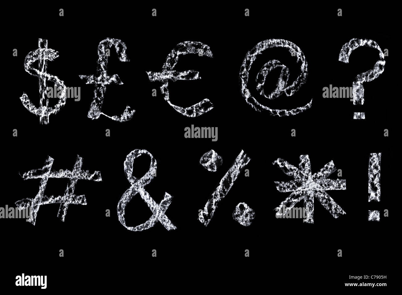 Handwritten symbols drawn on a blackboard, cleaned up during editing and placed on a black background. Stock Photo