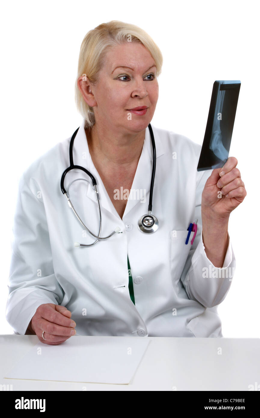 medical staff examined an Xray image which she holds in her hand Stock