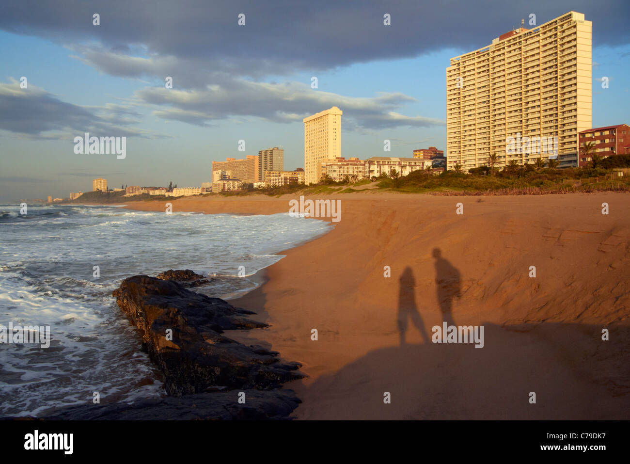 Shadows of couple on the beach at Amanzimtoti, KwaZulu-Natal, South Africa. Stock Photo