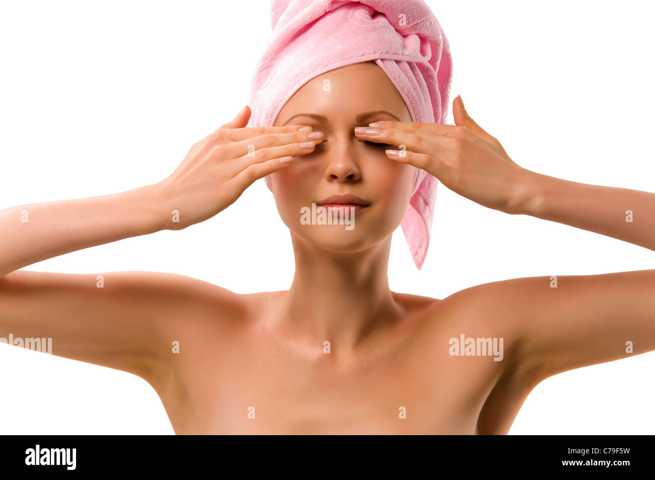 beautiful young woman after washing with a towel over your head Stock