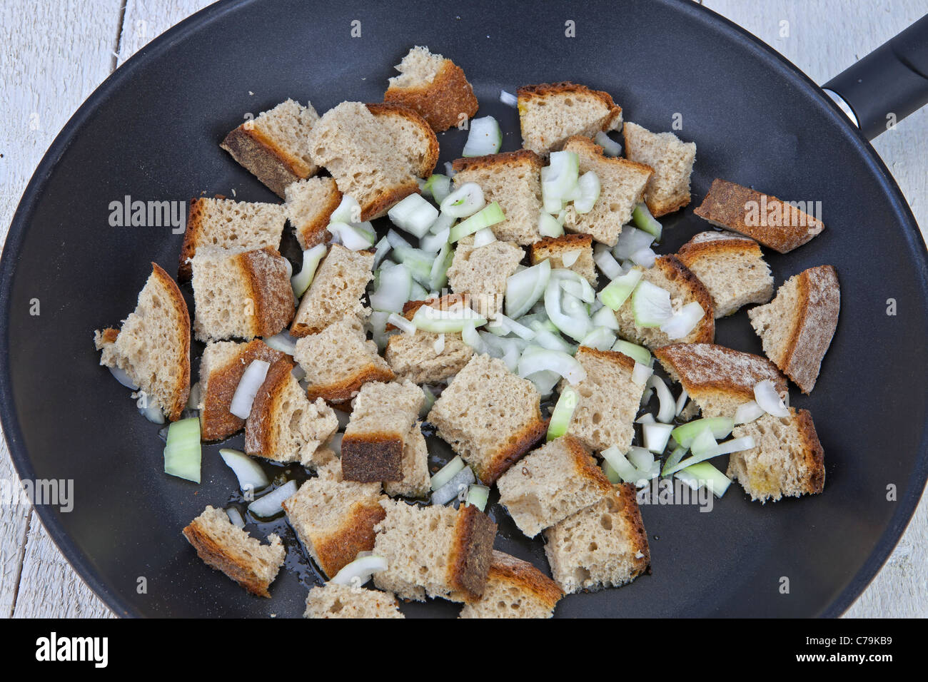 Bread and onions when cooking Appenzeller Brotkas Stock Photo