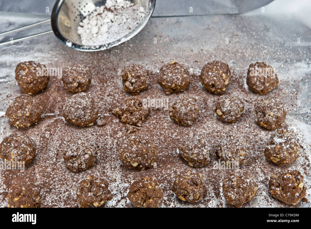 The finished balls are dusted with icing sugar and cocoa powder. Stock Photo
