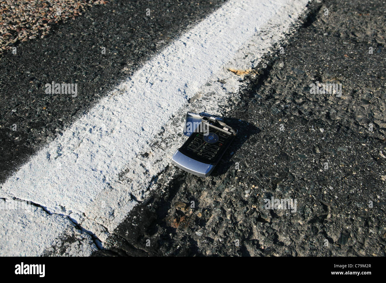 broken run over cell phone on the road side Stock Photo