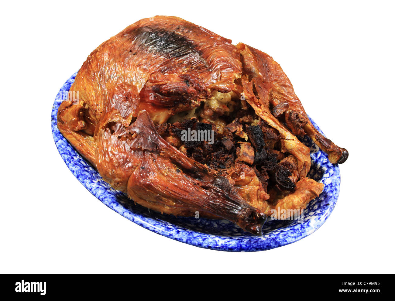 overcooked baked turkey on a platter isolated on white Stock Photo